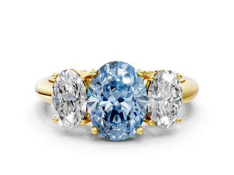 Yellow gold Three-Stone Fancy Blue Oval Cut Cut Diamond Engagement Ring with Prong Setting on a White Gold Band