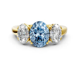 Yellow gold Three-Stone Fancy Blue Oval Cut Cut Diamond Ring with Channel Set Band and Four-Prong Setting