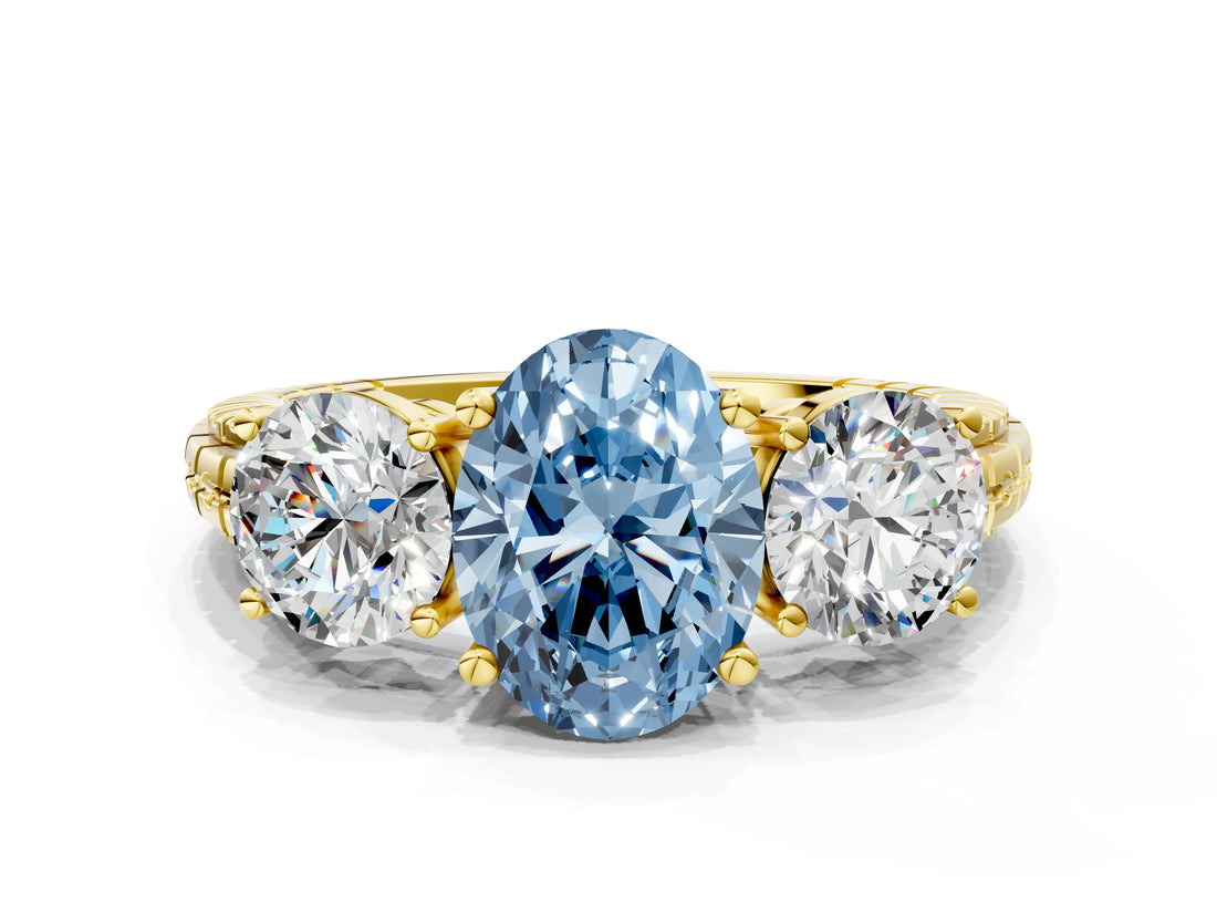 Yellow gold Three-Stone Fancy Blue Oval Cut Cut Diamond Ring with Channel-Set Band and Prong Setting