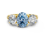 Yellow gold Three-Stone Fancy Blue Oval Cut Cut Diamond Ring with Channel-Set Band and Prong Setting