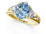 Yellow gold Three-Stone Fancy Blue Oval Cut Cut Diamond Ring with Trillion Side Stones on a Split Shank Band_1