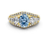 Yellow gold Three-Stone Fancy Blue Oval Cut Diamond Engagement Ring with Pave Band and Prong Setting