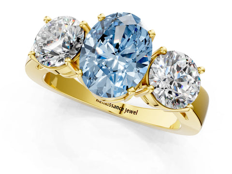 Yellow gold Three-Stone Fancy Blue Oval Cut Diamond Ring with Round Side Stones, Classic Band, and Four-Prong Setting_1