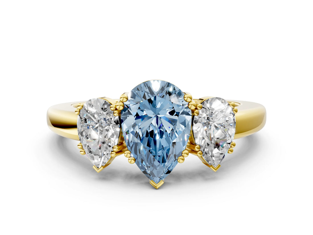 Yellow gold Three-Stone Fancy Blue Pear Cut Cut Diamond Ring with Channel Set Band and Four-Prong Setting