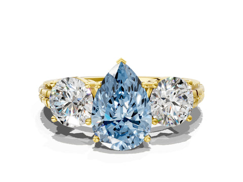 Yellow gold Three-Stone Fancy Blue Pear Cut Cut Diamond Ring with Channel-Set Band and Prong Setting