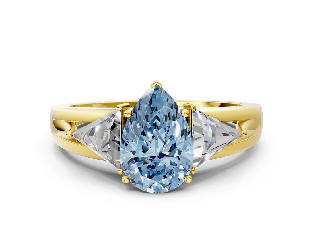 Yellow gold Three-Stone Fancy Blue Pear Cut Cut Diamond Ring with Trillion Side Stones on a Split Shank Band