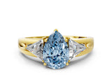 Yellow gold Three-Stone Fancy Blue Pear Cut Cut Diamond Ring with Trillion Side Stones on a Split Shank Band