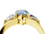 Yellow gold Three-Stone Fancy Blue Pear Cut Cut Diamond Ring with Trillion Side Stones on a Split Shank Band_4