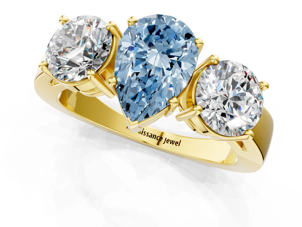 Yellow gold Three-Stone Fancy Blue Pear Cut Diamond Ring with Round Side Stones, Classic Band, and Four-Prong Setting