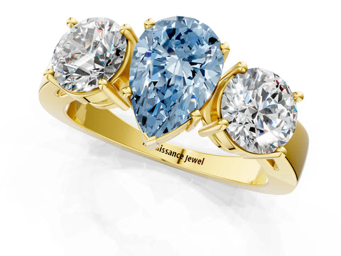 Yellow gold Three-Stone Fancy Blue Pear Cut Diamond Ring with Round Side Stones, Classic Band, and Four-Prong Setting_1