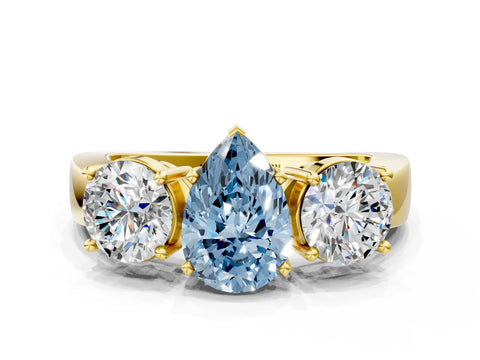 Yellow gold Three-Stone Fancy Blue Pear Cut Diamond Ring with Round Side Stones, Classic Band, and Four-Prong Setting