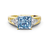 Yellow gold Three-Stone Fancy Blue Princess Cut Cut Diamond Ring with Trillion Side Stones on a Split Shank Band