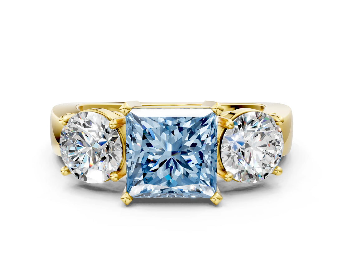 Yellow gold Three-Stone Fancy Blue Princess Cut Diamond Ring with Round Side Stones, Classic Band, and Four-Prong Setting