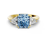 Yellow gold Three-Stone Fancy Blue Radiant Cut Cut Diamond Ring with Trillion Side Stones and Four-Prong Setting_3