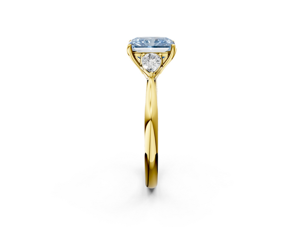 Yellow gold Three-Stone Fancy Blue Radiant  Cut Diamond Ring with Pear Side Stones in Four-Prong Setting