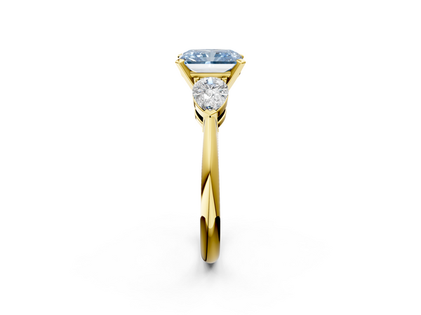 Yellow gold Three-Stone Fancy Blue Radiant Cut Diamond Ring with Pear Side Stones and Four-Prong Setting