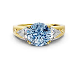 Yellow gold Three-Stone Fancy Blue Round Cut Cut Diamond Ring with Trillion Side Stones on a Split Shank Band