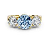 Yellow gold Three-Stone Fancy Blue Round Cut Diamond Ring with Round Side Stones, Classic Band, and Four-Prong Setting