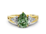 Yellow gold Three-Stone Fancy Green Pear Cut Cut Diamond Ring with Trillion Side Stones on a Split Shank Band
