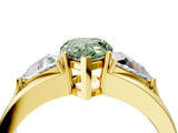 Yellow gold Three-Stone Fancy Green Pear Cut Cut Diamond Ring with Trillion Side Stones on a Split Shank Band_4