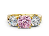 Yellow gold Three-Stone Fancy Pink Cushion Cut Diamond Ring with Round Side Stones, Classic Band, and Four-Prong Setting