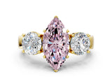 Yellow gold Three-Stone Fancy Pink Marquise Cut Diamond Ring with Round Side Stones, Classic Band, and Four-Prong Setting