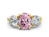 Yellow gold Three-Stone Fancy Pink Oval  Brilliant Cut Solitaire Ring with Prong Setting on a Classic Band
