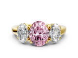 Yellow gold Three-Stone Fancy Pink Oval Cut Cut Diamond Ring with Channel Set Band and Four-Prong Setting