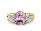 Yellow gold Three-Stone Fancy Pink Oval Cut Cut Diamond Ring with Trillion Side Stones on a Split Shank Band