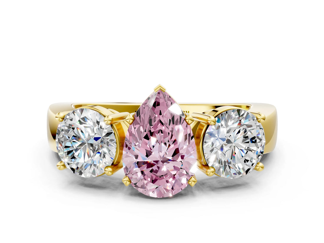 Yellow gold Three-Stone Fancy Pink Pear Cut Diamond Ring with Round Side Stones, Classic Band, and Four-Prong Setting