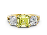 Yellow gold Three-Stone Fancy Yellow Asscher Cut Cut Diamond Ring with Channel Set Band and Four-Prong Setting