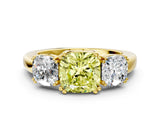 Yellow gold Three-Stone Fancy Yellow Cushion Cut Cut Diamond Ring with Channel Set Band and Four-Prong Setting