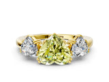 Yellow gold Three-Stone Fancy Yellow Heart Cut Cut Diamond Ring with Channel Set Band and Four-Prong Setting