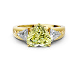 Yellow gold Three-Stone Fancy Yellow Heart Cut Cut Diamond Ring with Trillion Side Stones on a Split Shank Band