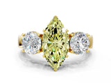 Yellow gold Three-Stone Fancy Yellow Marquise Cut Diamond Ring with Round Side Stones, Classic Band, and Four-Prong Setting