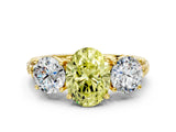 Yellow gold Three-Stone Fancy Yellow Oval Cut Cut Diamond Ring with Channel-Set Band and Prong Setting