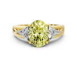 Yellow gold Three-Stone Fancy Yellow Oval Cut Cut Diamond Ring with Trillion Side Stones on a Split Shank Band