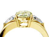 Yellow gold Three-Stone Fancy Yellow Oval Cut Cut Diamond Ring with Trillion Side Stones on a Split Shank Band_4