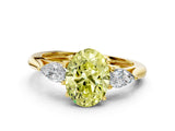 Yellow gold Three-Stone Fancy Yellow Oval Cut Diamond Ring with Pear  Side Stones in Four-Prong Setting_12