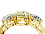 Yellow gold Three-Stone Fancy Yellow Oval Cut Diamond Ring with Round Side Stones, Classic Band, and Four-Prong Setting_16