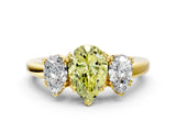 Yellow gold Three-Stone Fancy Yellow Pear Cut Cut Diamond Ring with Channel Set Band and Four-Prong Setting