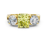 Yellow gold Three-Stone Fancy Yellow Radiant Cut Diamond Ring with Round Side Stones, Classic Band, and Four-Prong Setting