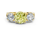 Yellow gold Three-Stone Fancy Yellow Round Cut Diamond Ring with Round Side Stones, Classic Band, and Four-Prong Setting