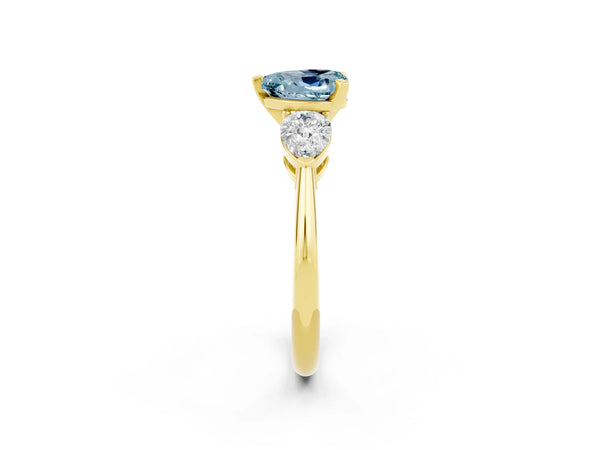 Yellow gold Three-Stone Heart Cut Aquamarine Ring with Pear Side Stones and Four-Prong Setting
