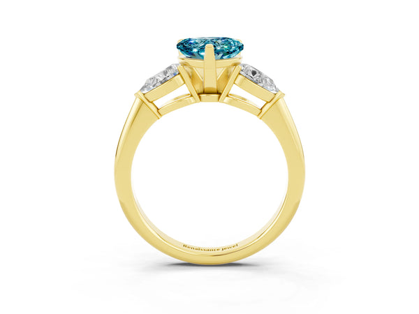 Yellow gold Three-Stone Heart Cut Blue Topaz Ring with Pear Side Stones and Four-Prong Setting