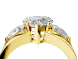 Yellow gold Three-Stone Heart Cut Cut Diamond Ring with Trillion Side Stones on a Split Shank Band_19