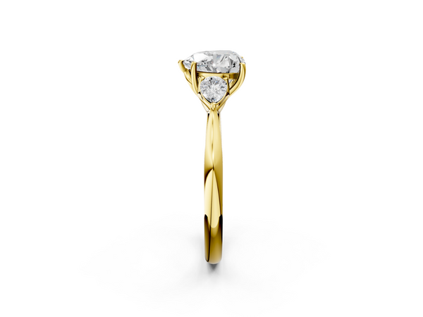 Yellow gold Three-Stone Heart Cut Diamond Ring with Pear Side Stones in Four-Prong Setting