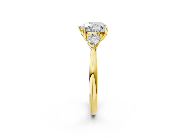 Yellow gold Three-Stone Heart Cut Diamond Ring with Pear  Side Stones in Four-Prong Setting