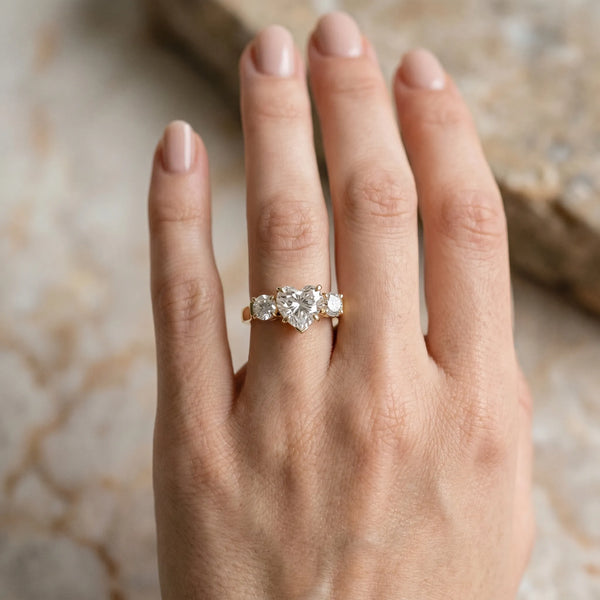 Yellow gold Three-Stone Heart Cut Diamond Ring with Round Accent Stones, Prong Setting, and Classic Band