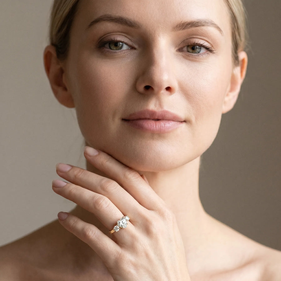 Yellow gold Three-Stone Heart Cut Diamond Ring with Round Accent Stones, Prong Setting, and Classic Band
